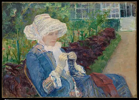 Lydia ganchillando en el jardín de Marly