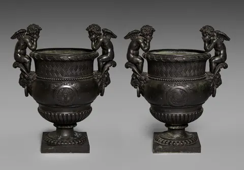 Pair of Urns with Putti