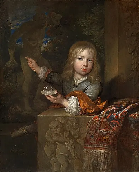 A Boy Blowing Soap Bubbles