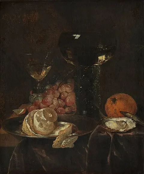 Still life with lemon, grapes and glasses