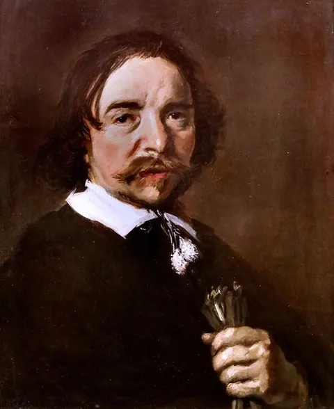 Portrait of a man with a tassle collar holding gloves or flax