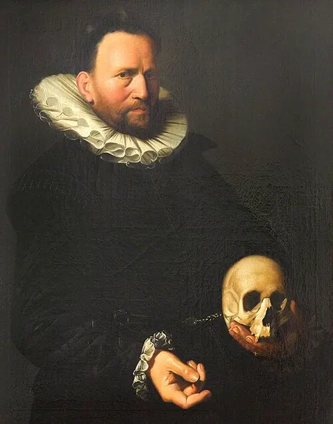 Portrait of a Man Holding a Skull