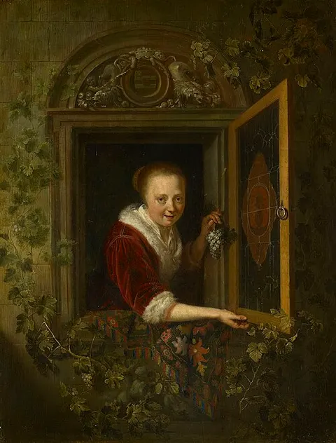 A Girl with a Bunch of Grapes at a Window