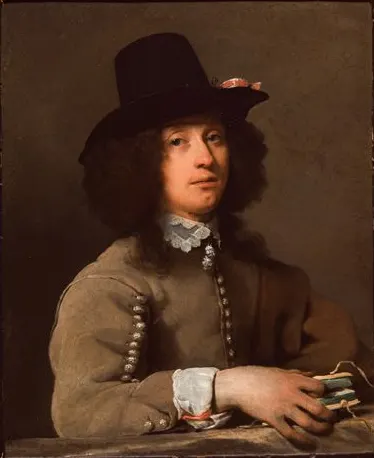 Portrait of a young man with a hat holding a book