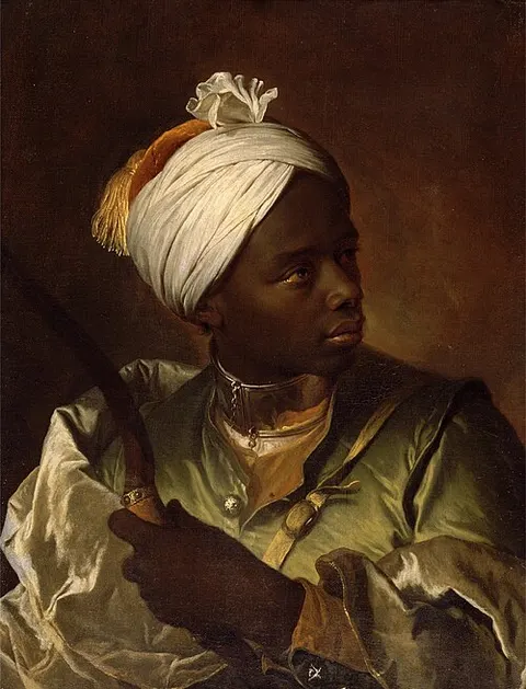 Joven negro sosteniendo un arco