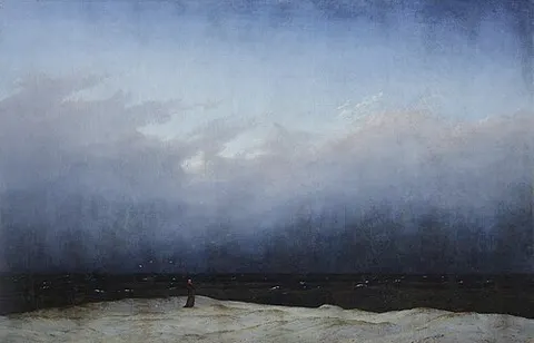 Monje a la orilla del mar