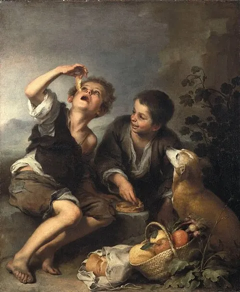 Niños comiendo de una tartera